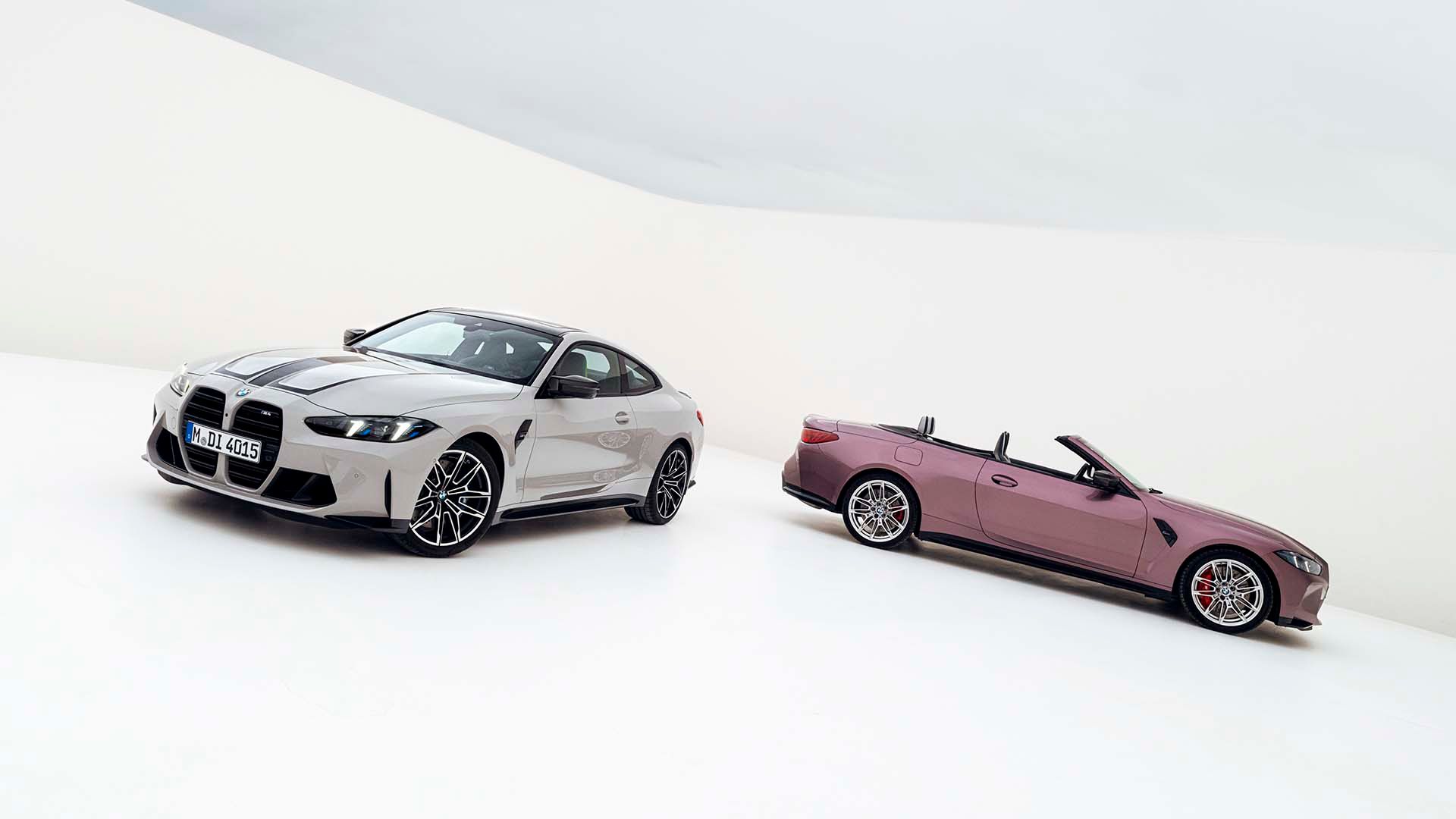 Side-by-side shot of the 2025 BMW M4 Coupe and Convertible