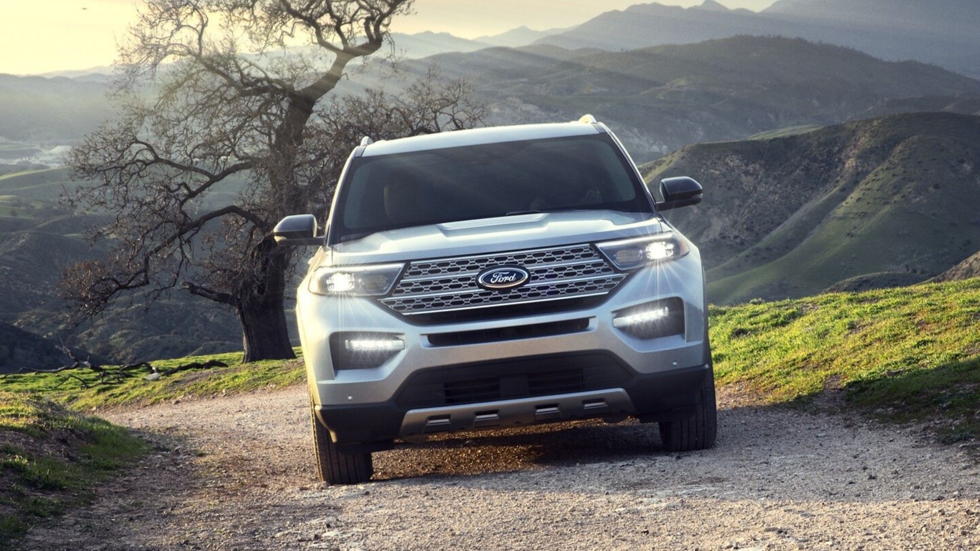 2024 Ford Explorer White driving on dirt road in the hills