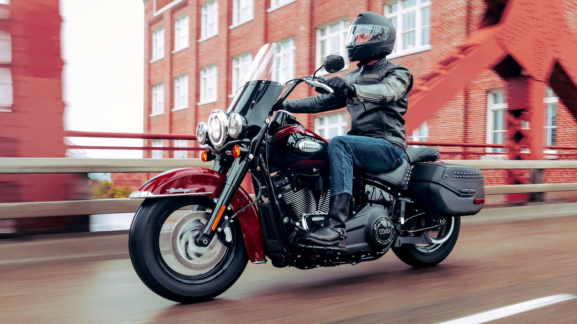 2024 Harley-Davidson Heritage Classic 114 cruising over a bridge