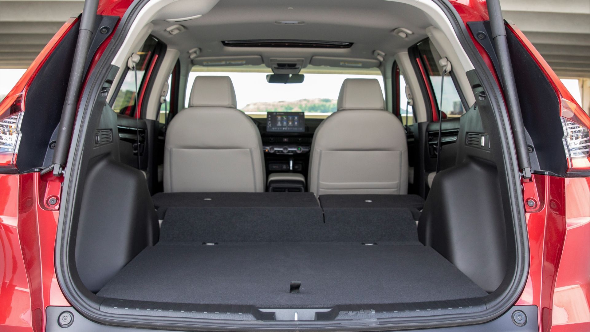 Shot from the rear of the 2023 Honda CR-V with the trunk open