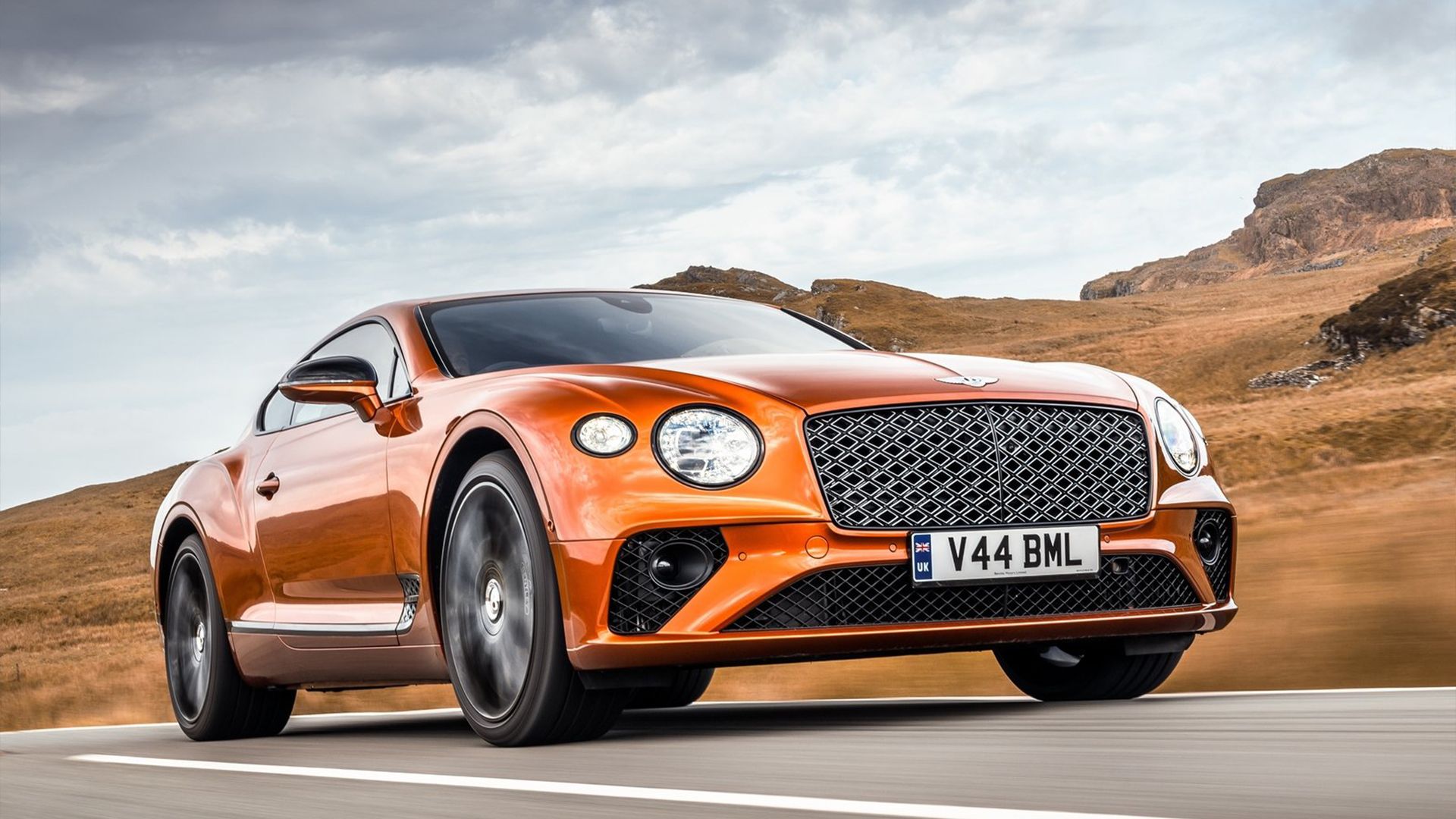 2024 Bentley Continental GT in orange posit on road