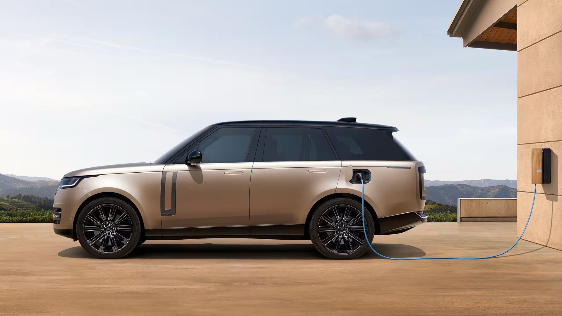 2024 Land Rover Range Rover Autobiography P550e in copper charging from powerpoint