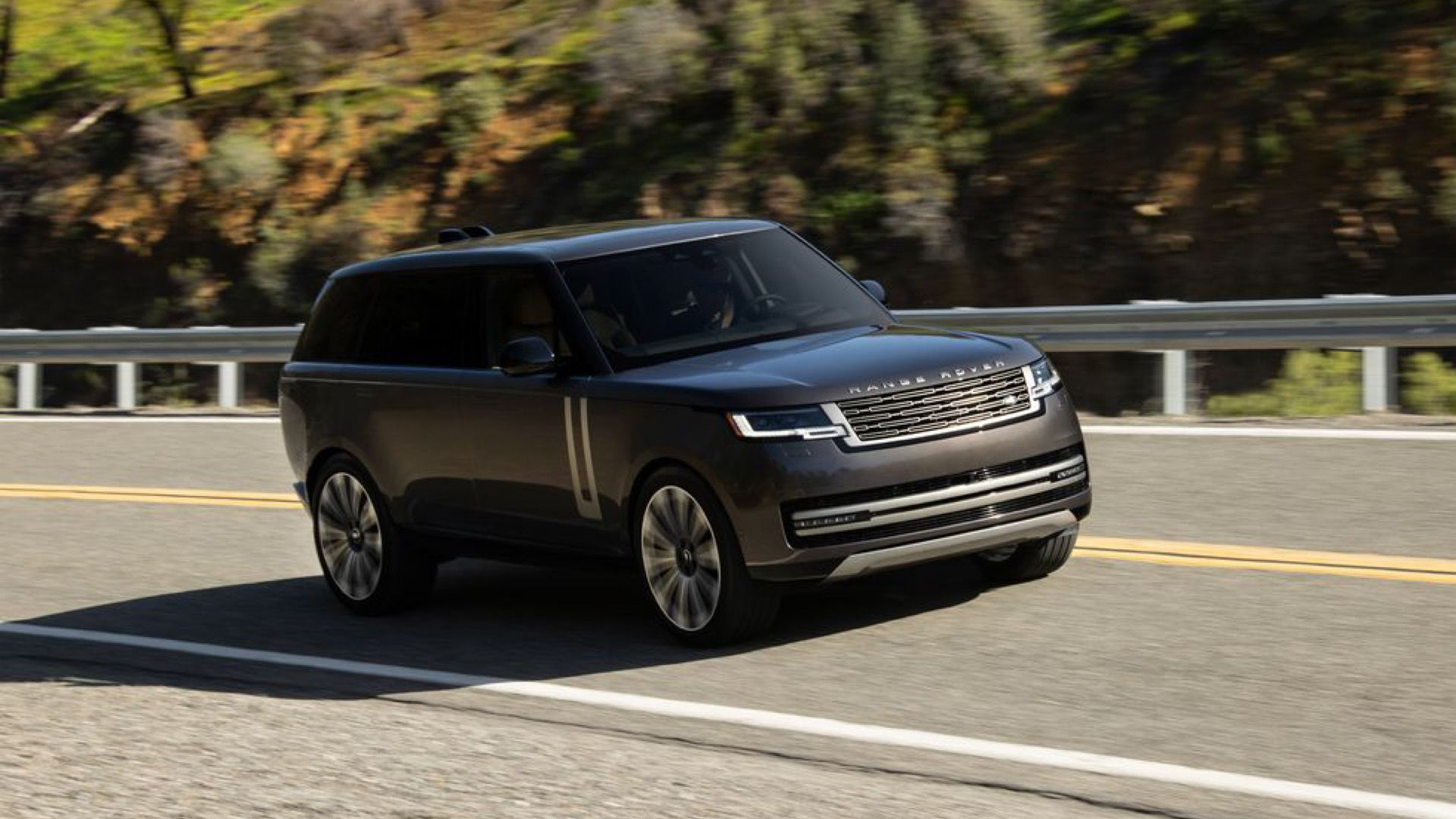 2024 Land Rover Range Rover P530 Autobiography Long Wheelbase In black posing on highway