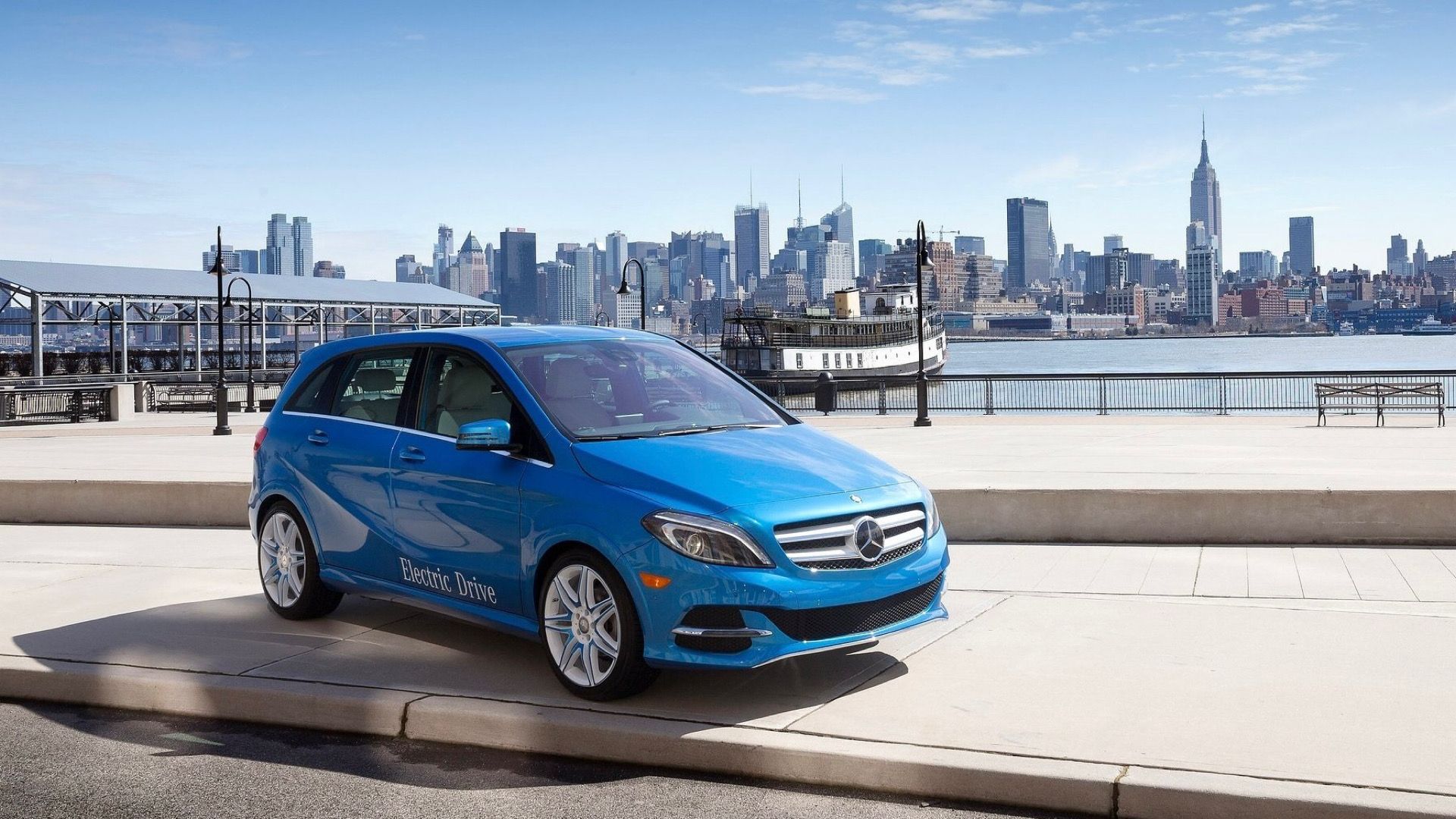 2015 Mercedes-Benz B-Class Electric Drive In blue posing in front of city 