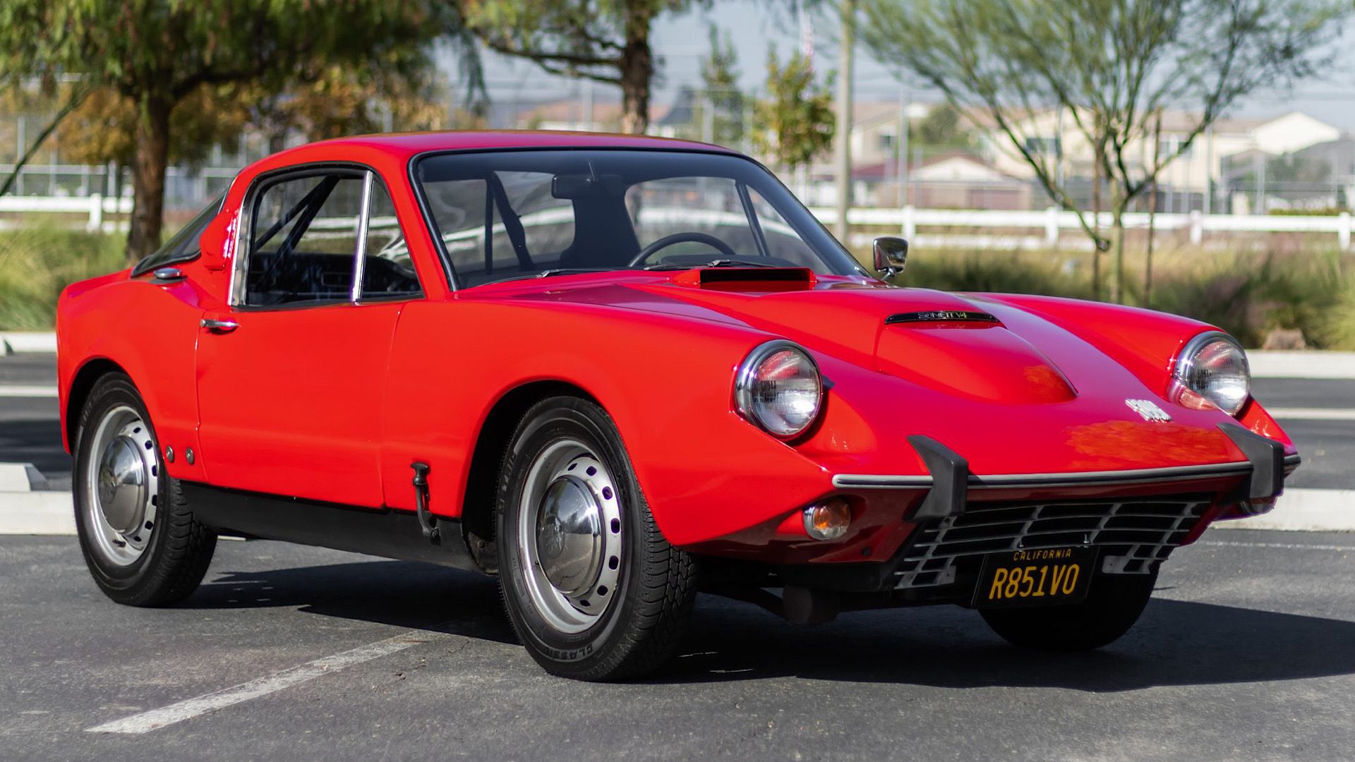 1968 SAAB Sonett V4 in red Posing in parking lot