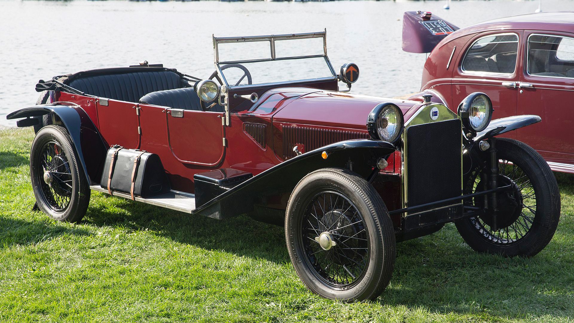1924 Lancia Lambda in red With roof down in front of lake