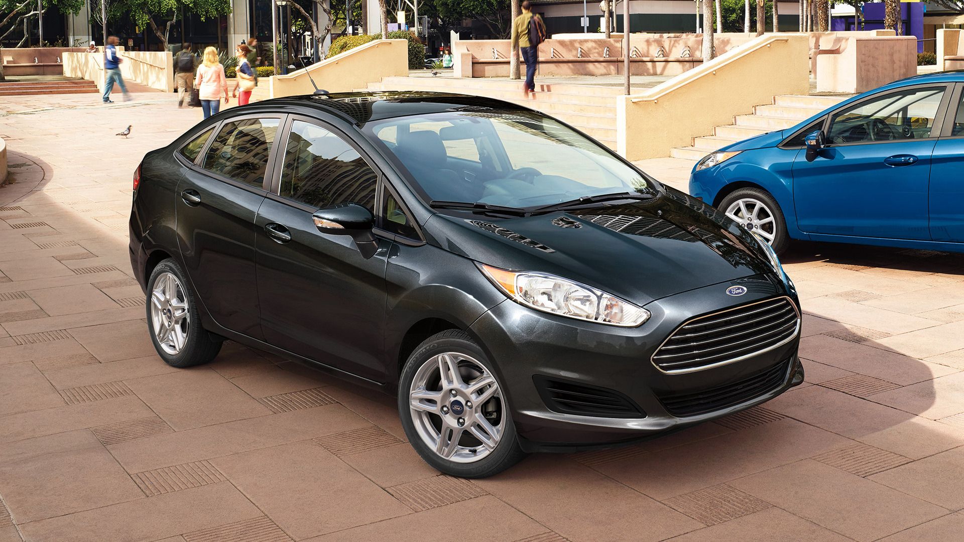 A 2018 Ford Fiesta Sedan parked next to a Ford Fiesta hatchback.