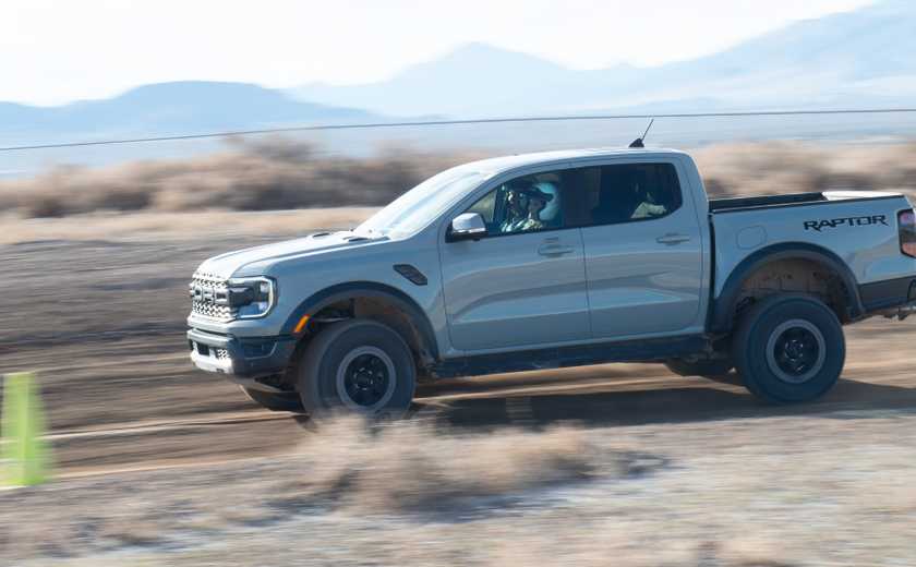 2024 Ford Ranger Raptor driving by fast