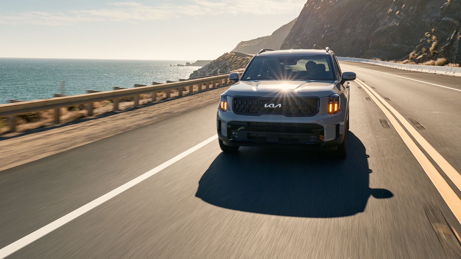 2024 Kia Telluride front action shot driving on a coastal road