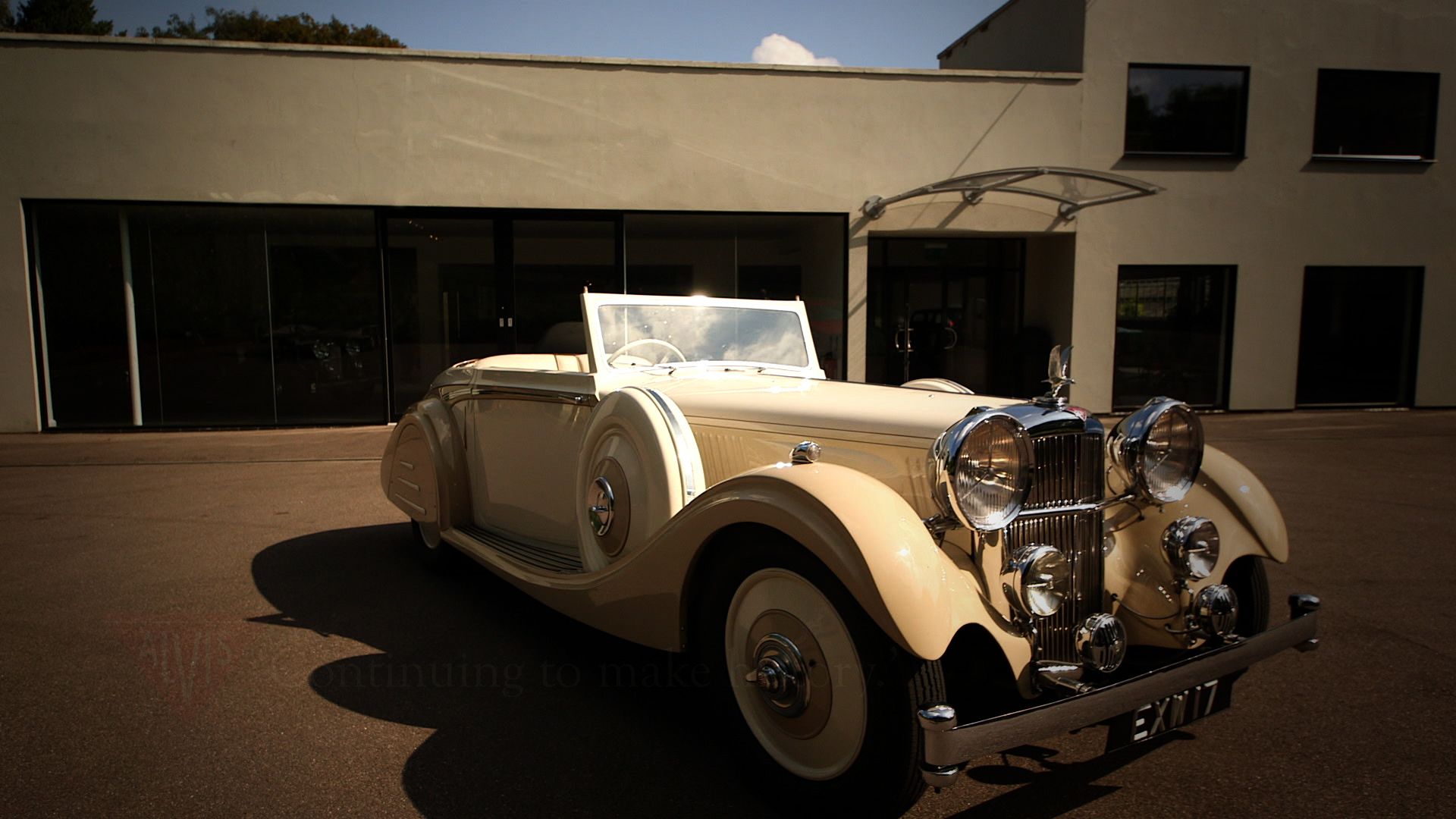 Alvis Lancefield 3.0L Cream parked in front of a gray building