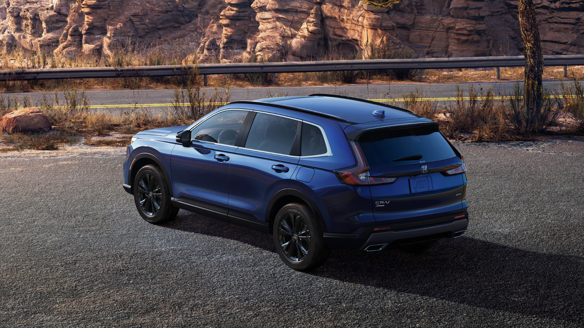 Rear three-quarters shot of a blue Honda CR-V Hybrid 