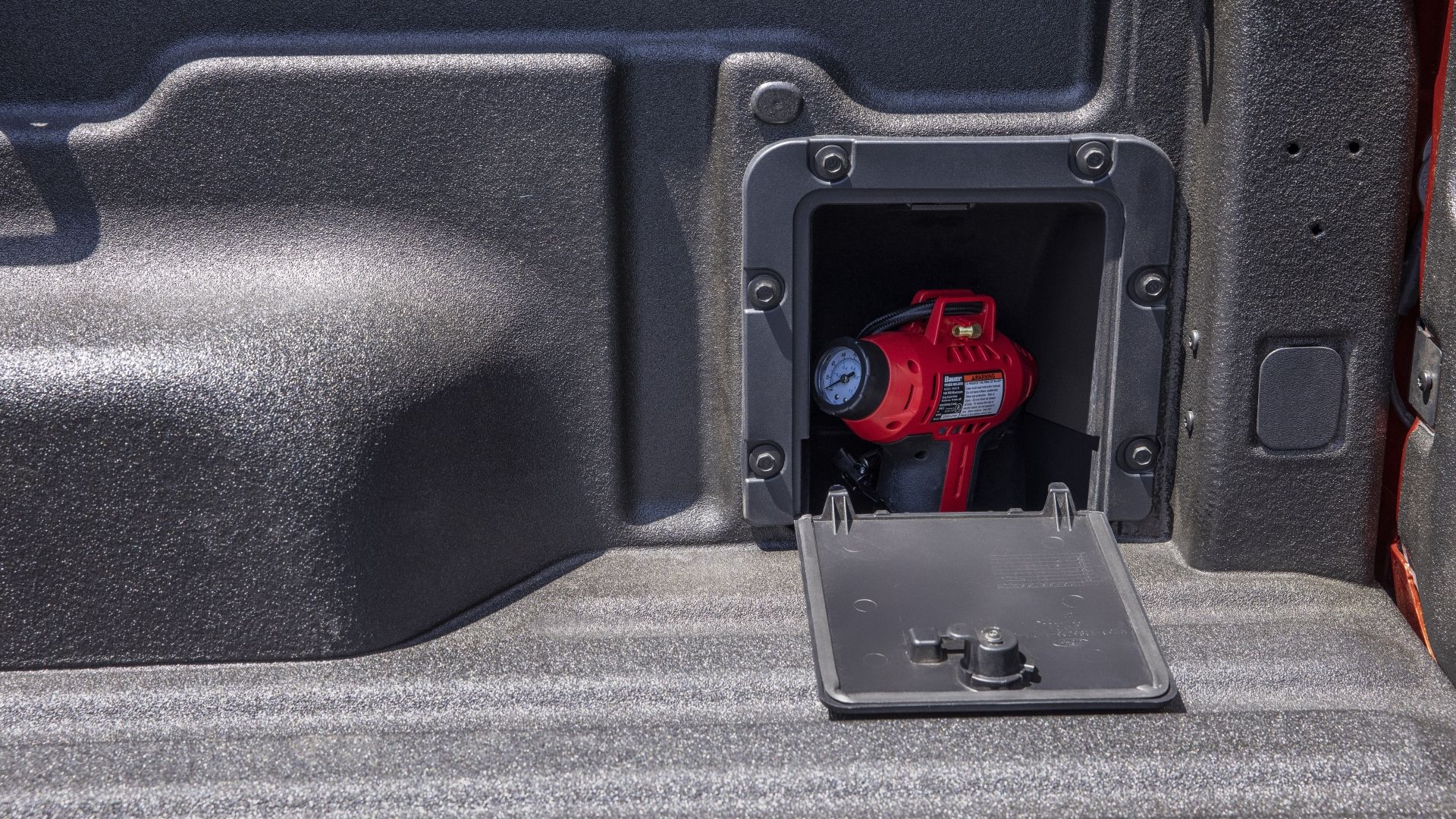 Close up of the storage cubby in the truck bed of the 2024 Ford Maverick