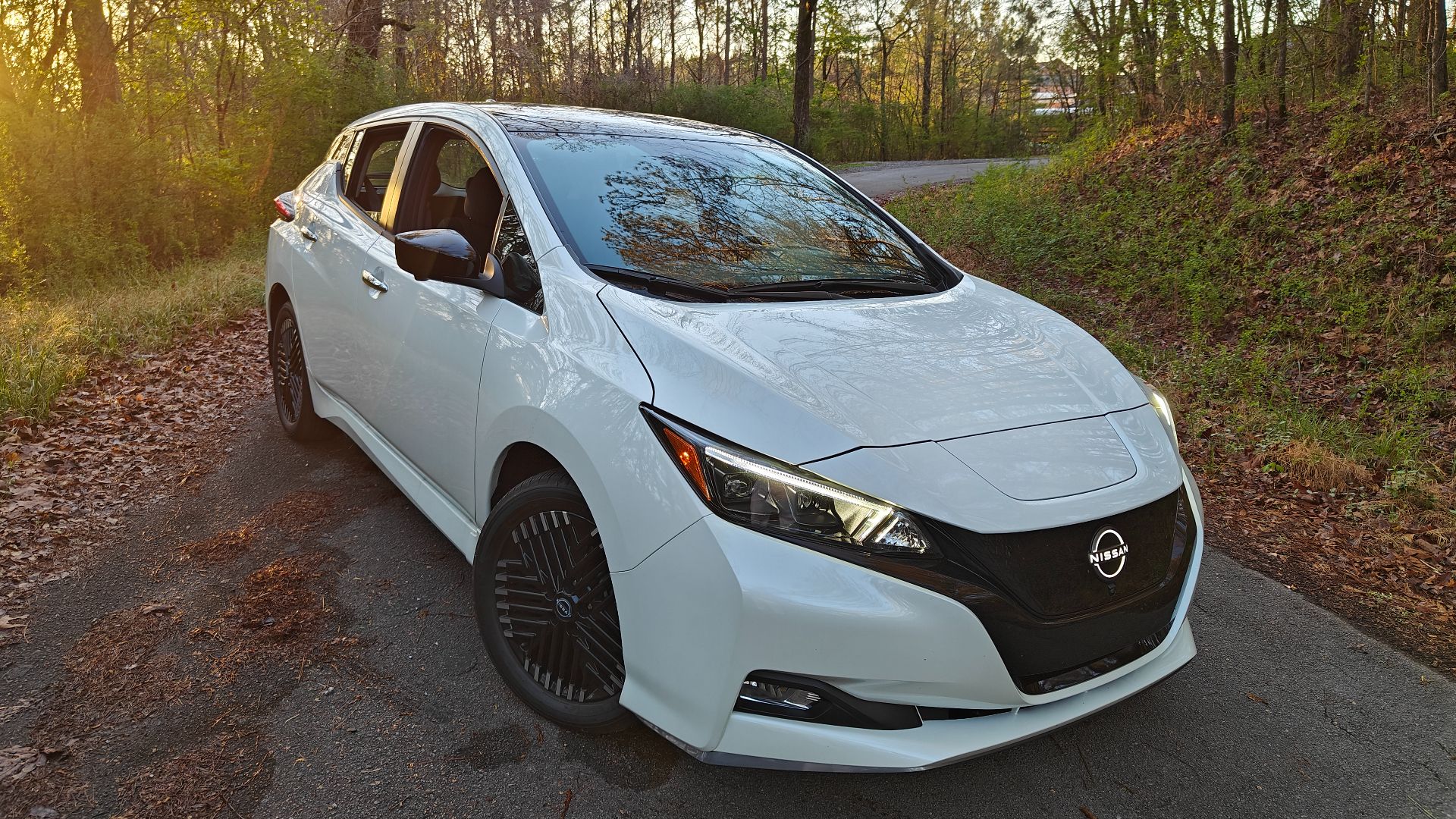 White 2024 Nissan Leaf on a wilderness road