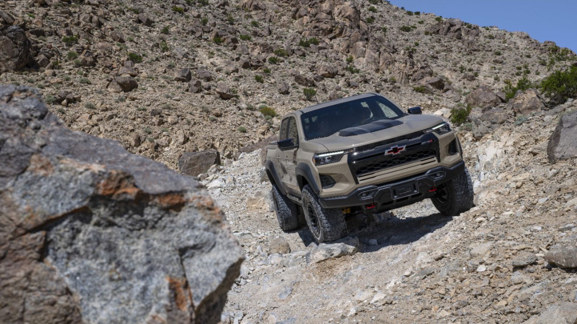 2024 Chevrolet Colorado Bison ZR2 in sand Posing on rocky terrain 