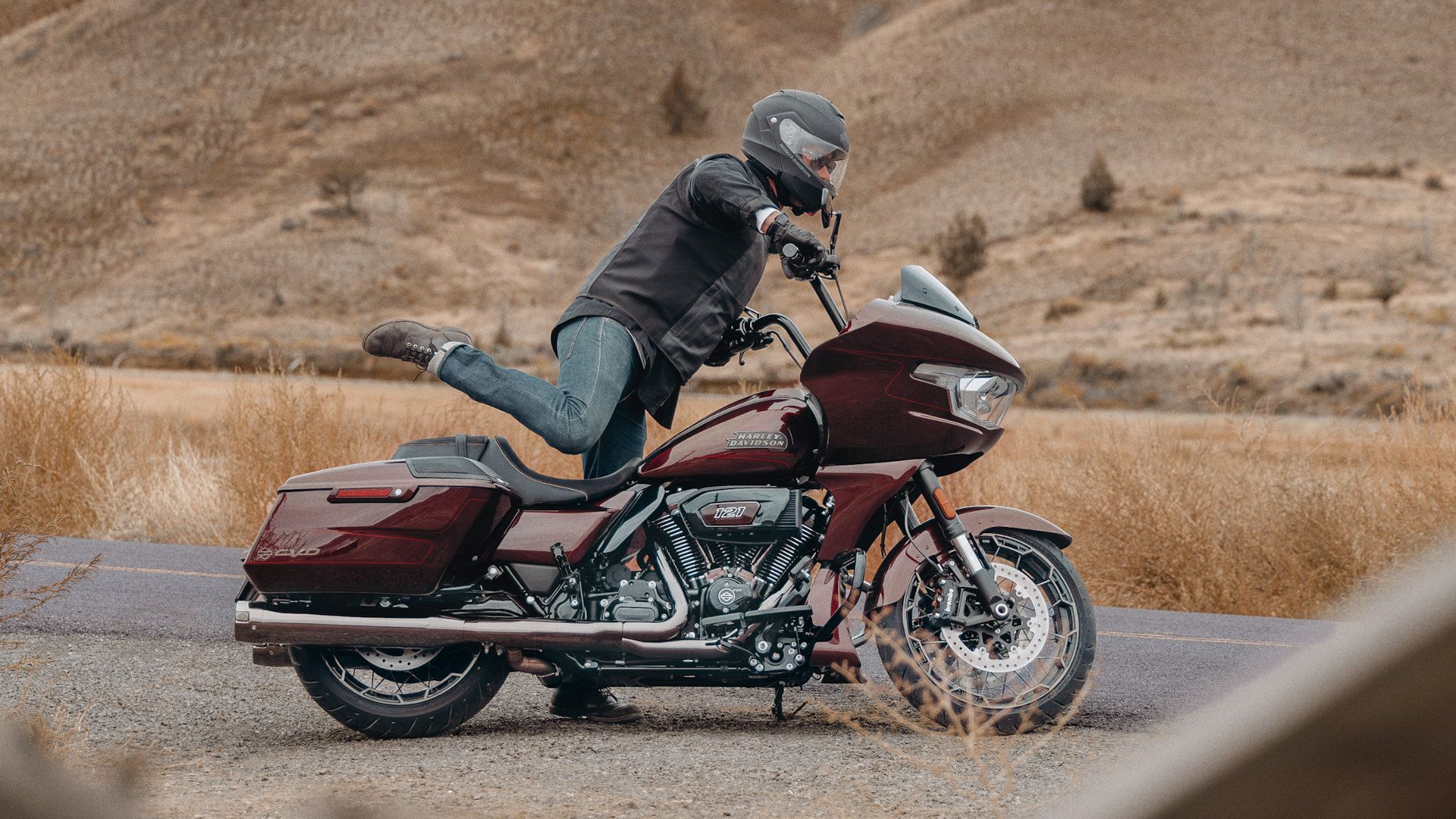 Rider mounting a 2024 Harley-Davidson CVO Road Glide