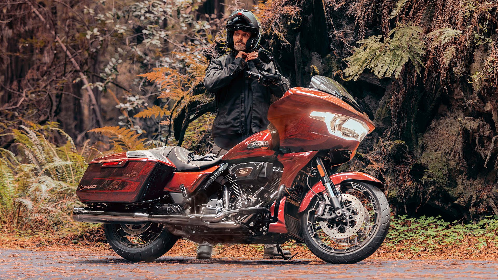 Rider standing next to a 2024 Harley-Davidson CVO Road Glide