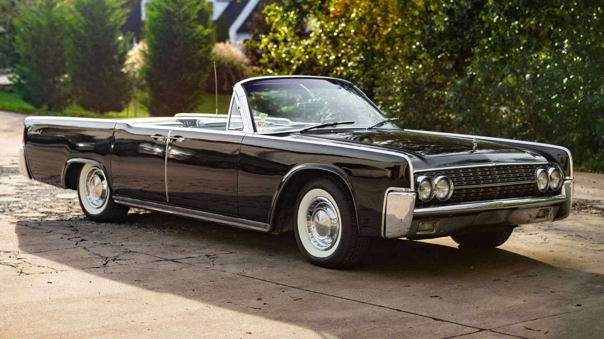 Black 1962 Lincoln Continental Mark IV Parked With Roof Down Front 3/4 View