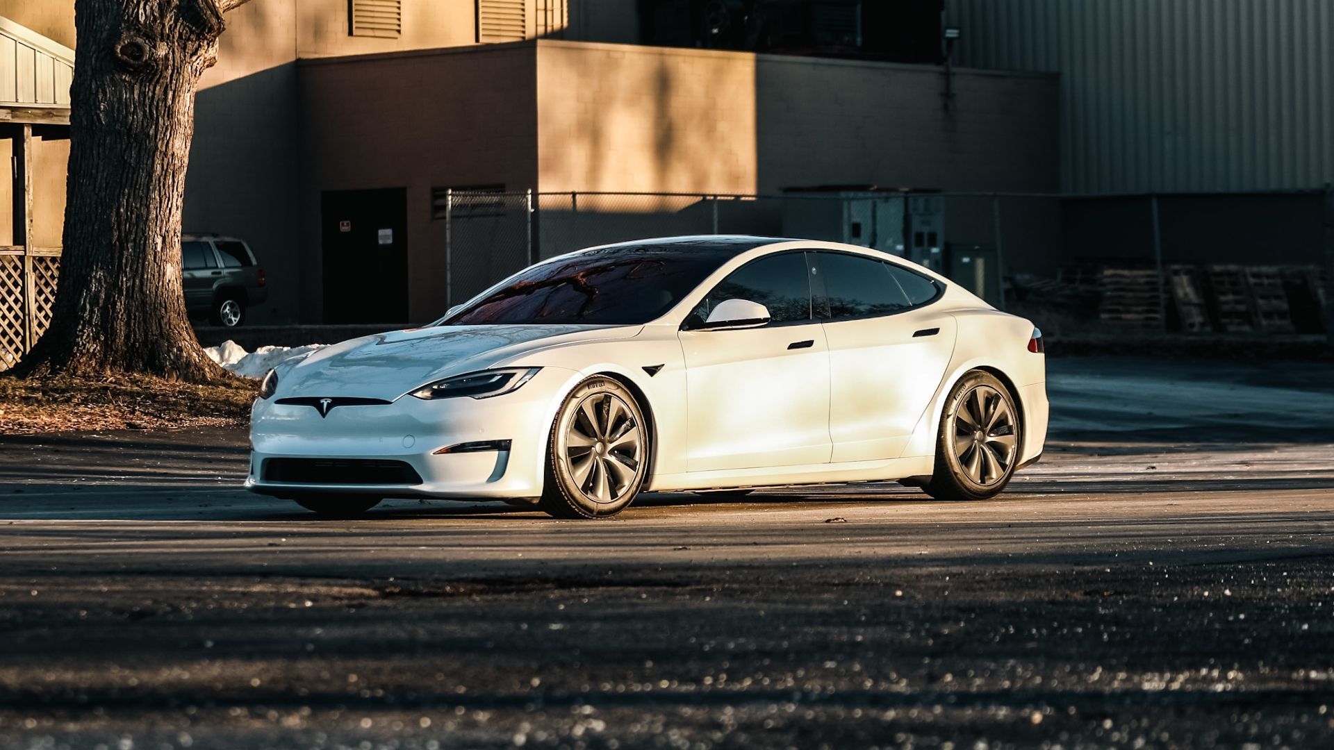 Front three-quarters shot of a parked 2021 White Tesla Model S Plaid
