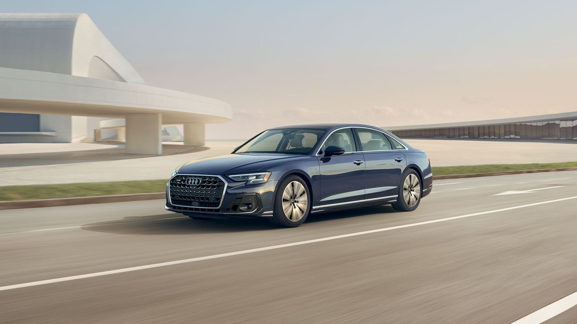 A Blue 2024 Audi A8 Driving 