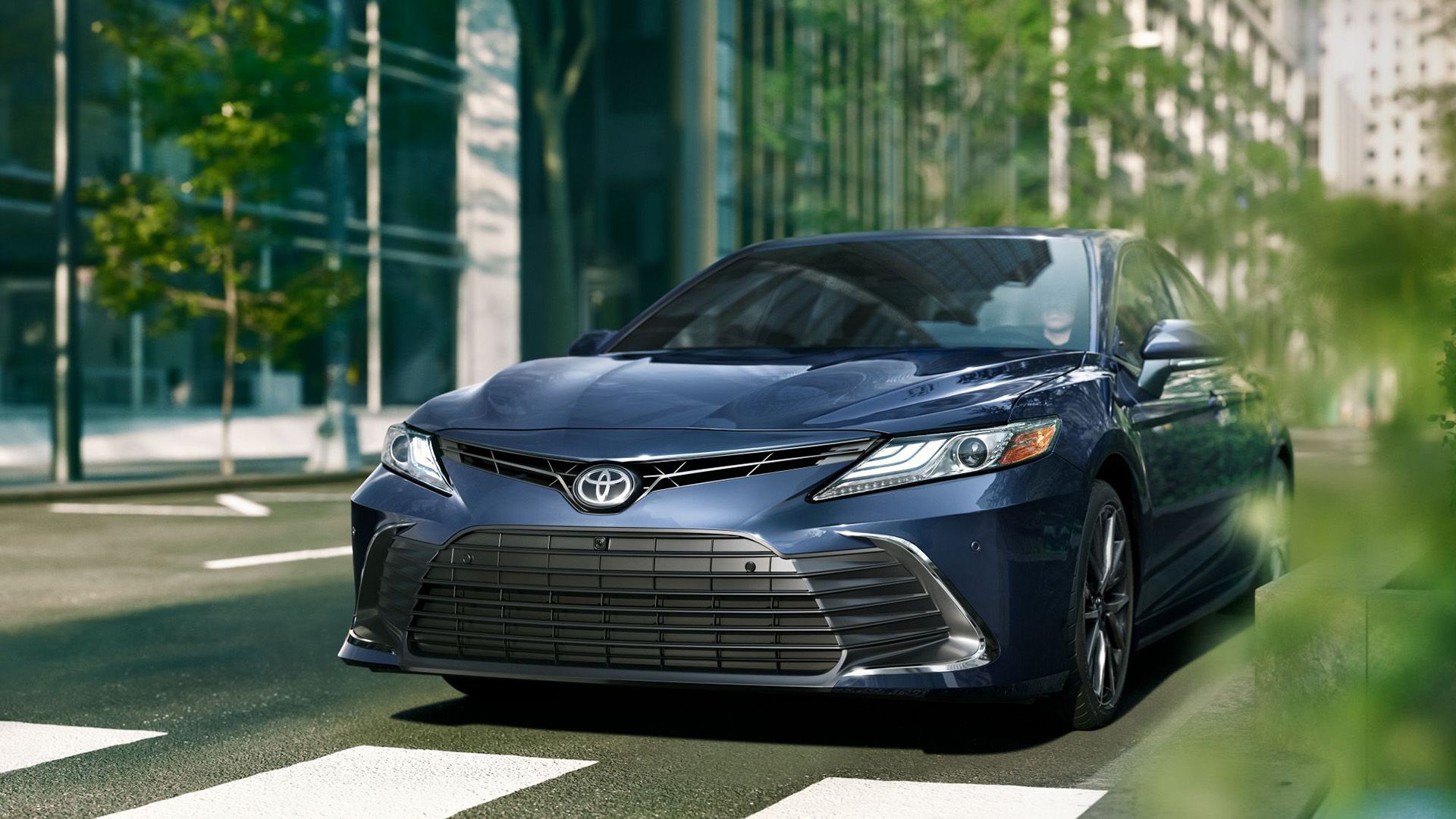 A Blue 2024 Toyota Camry Parked