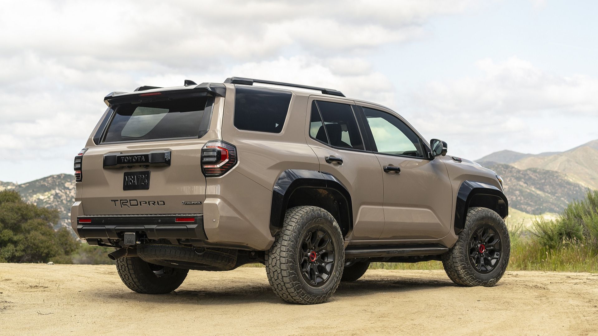 2025 Toyota 4Runner rear angle view with mountains as backdrop