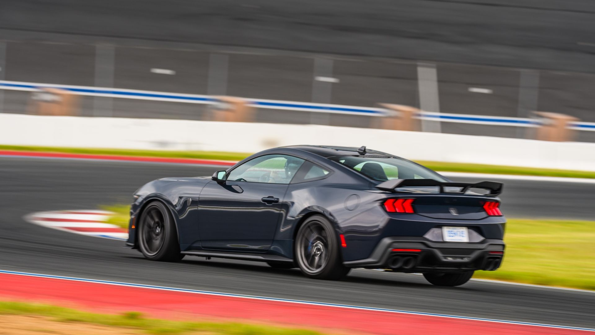 Rear 3/4 action shot of the 2024 Ford Mustang Dark Horse