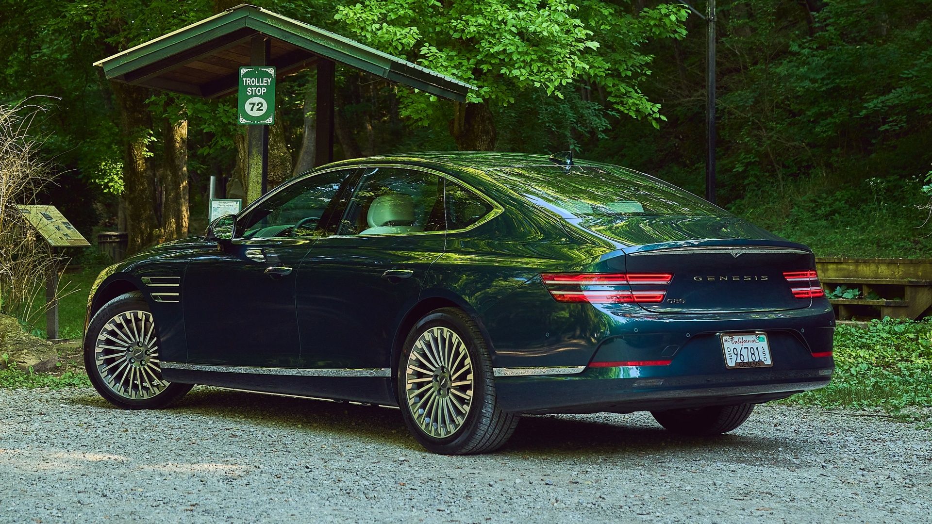 Genesis Electrified G80 Rear 3/4 parked in front of a trolley stop