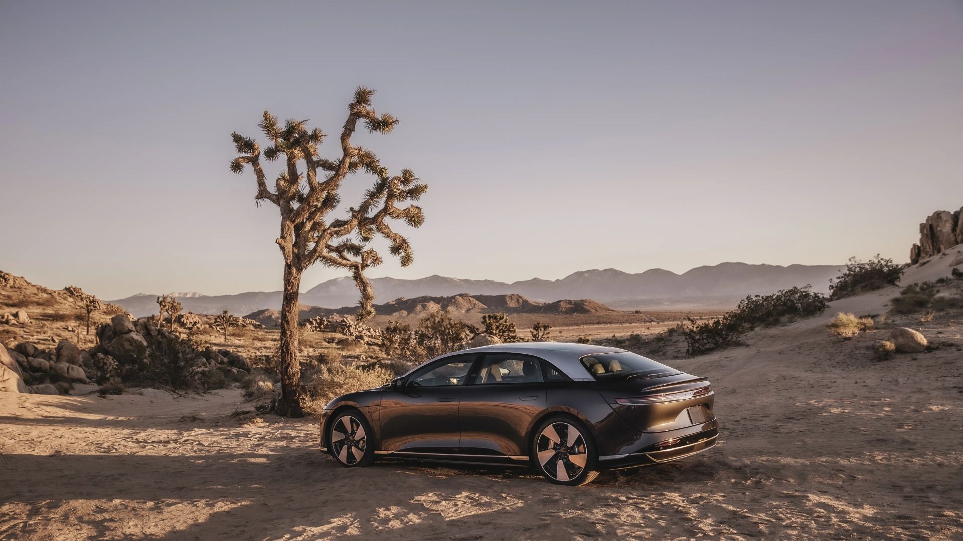 2024 Lucid Air Grand Touring side profile shot in a desert