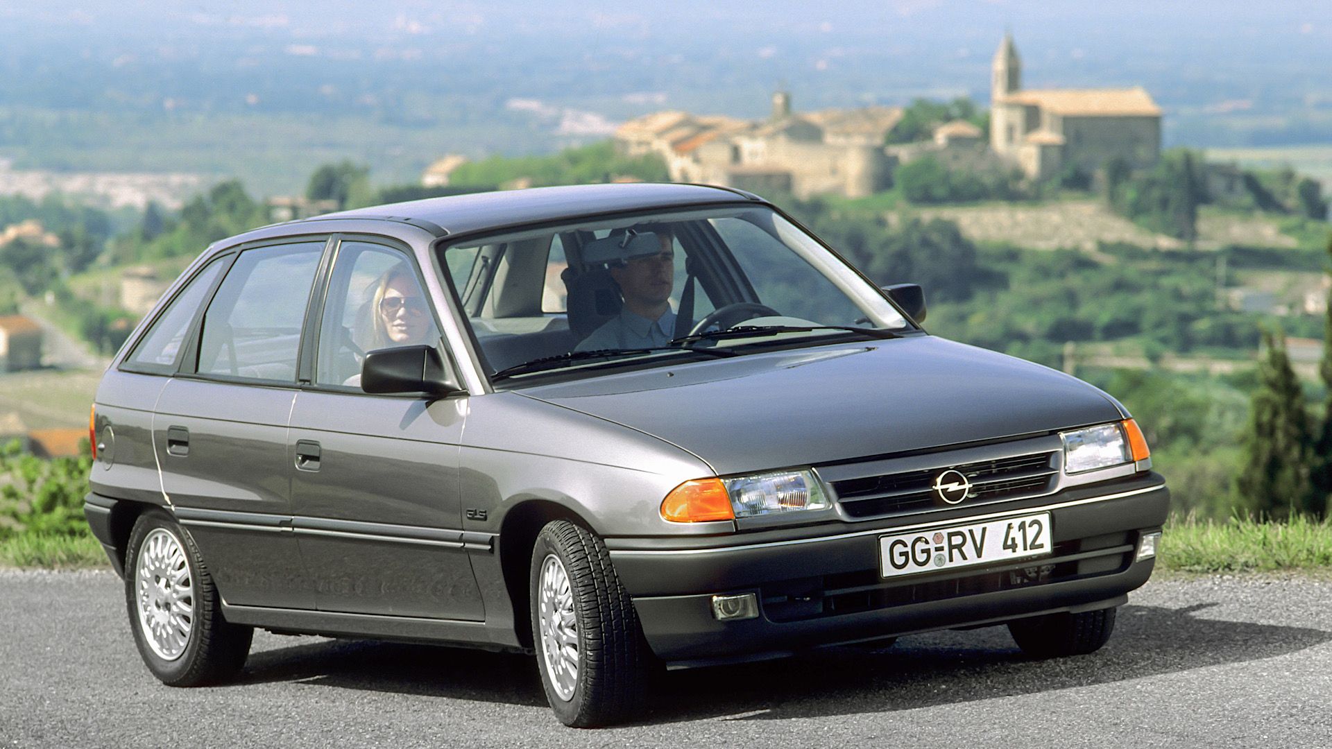 1991 Opel Astra F in gray Posing on hill-road