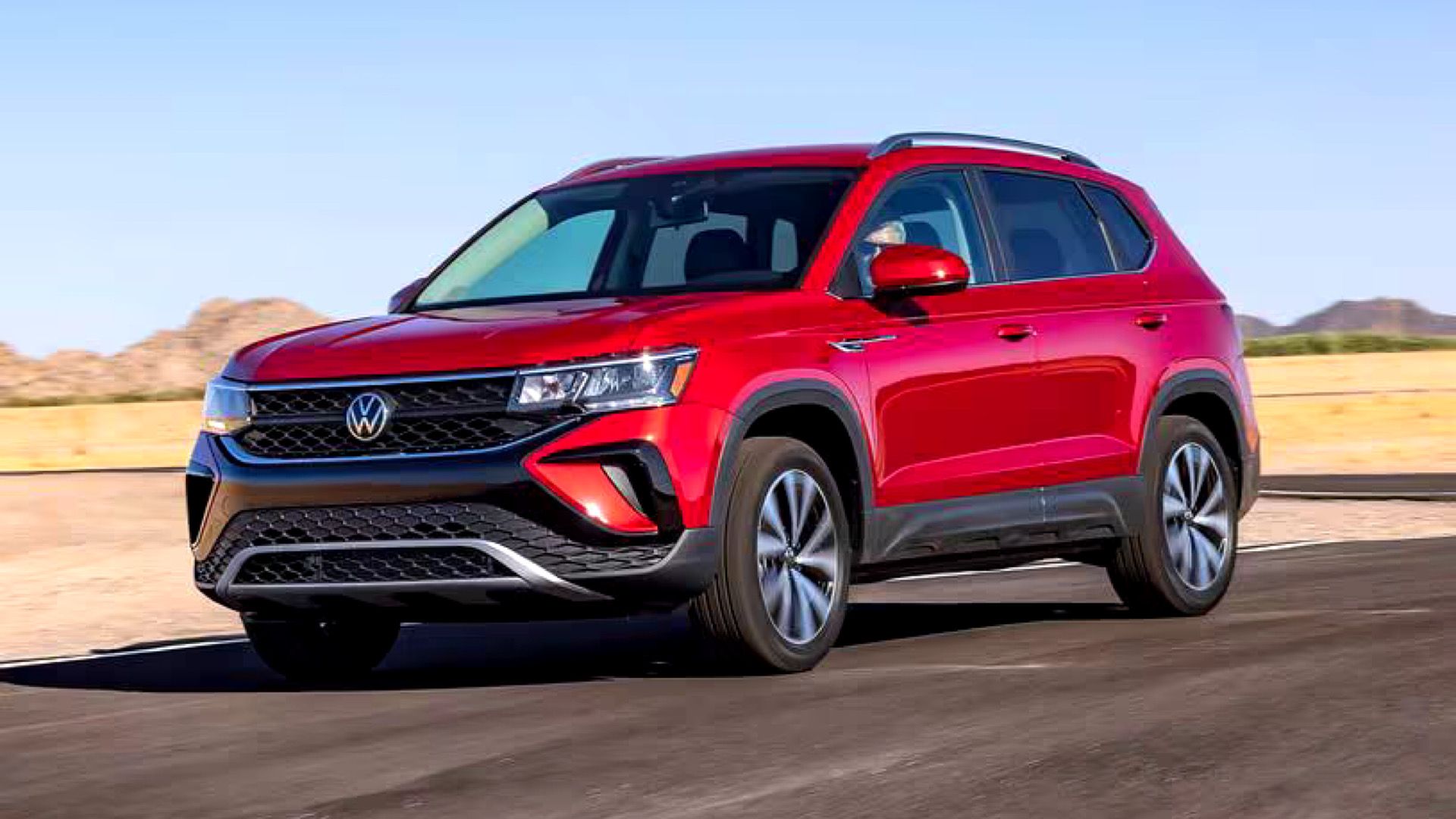 2024 Volkswagen Taos in red Posing on desert road