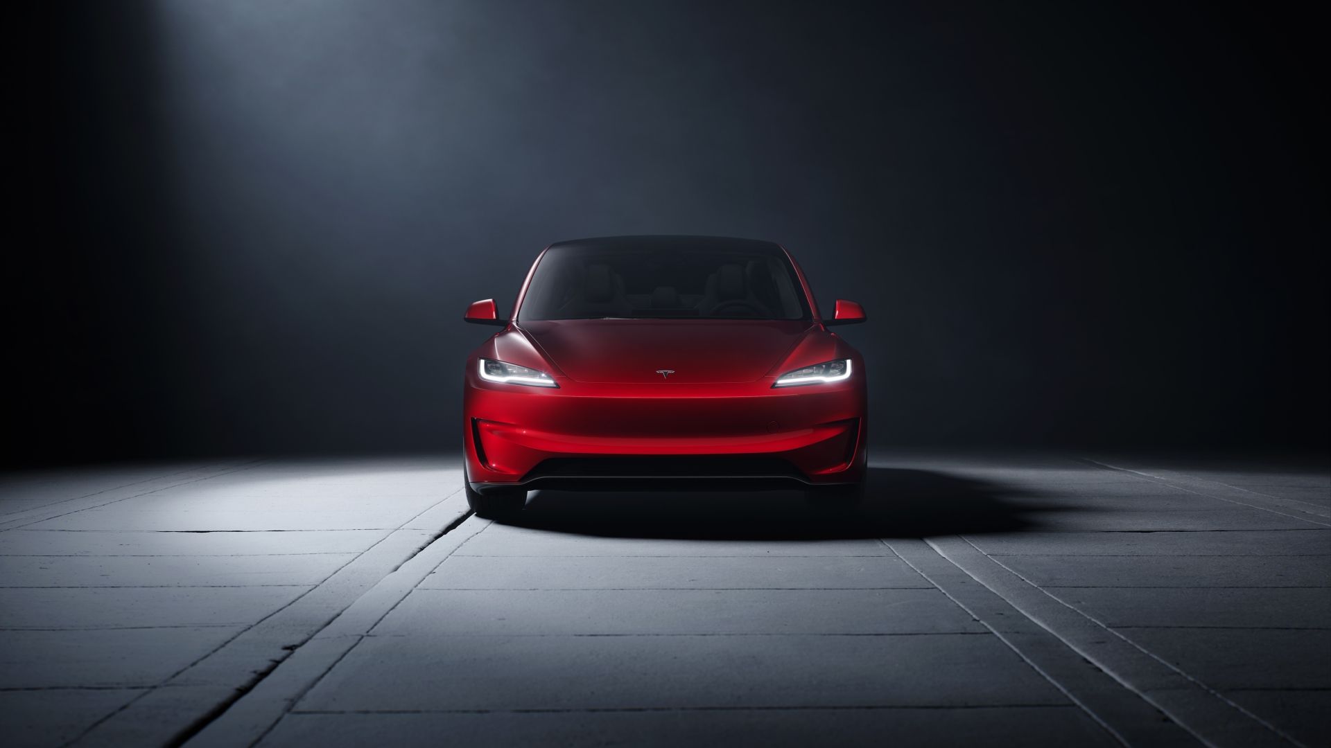 Front-end shot of a red 2024 Tesla Model 3 Performance
