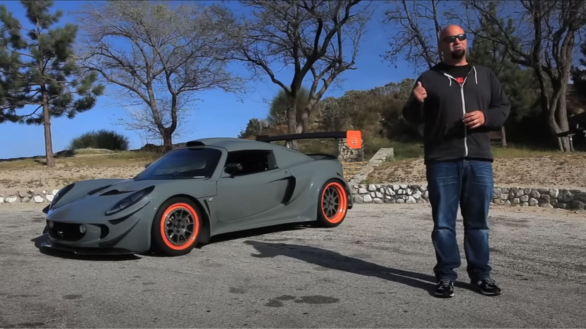 The World's Fastest Lotus Exige parked in a lot with Matt Farah standing next to it