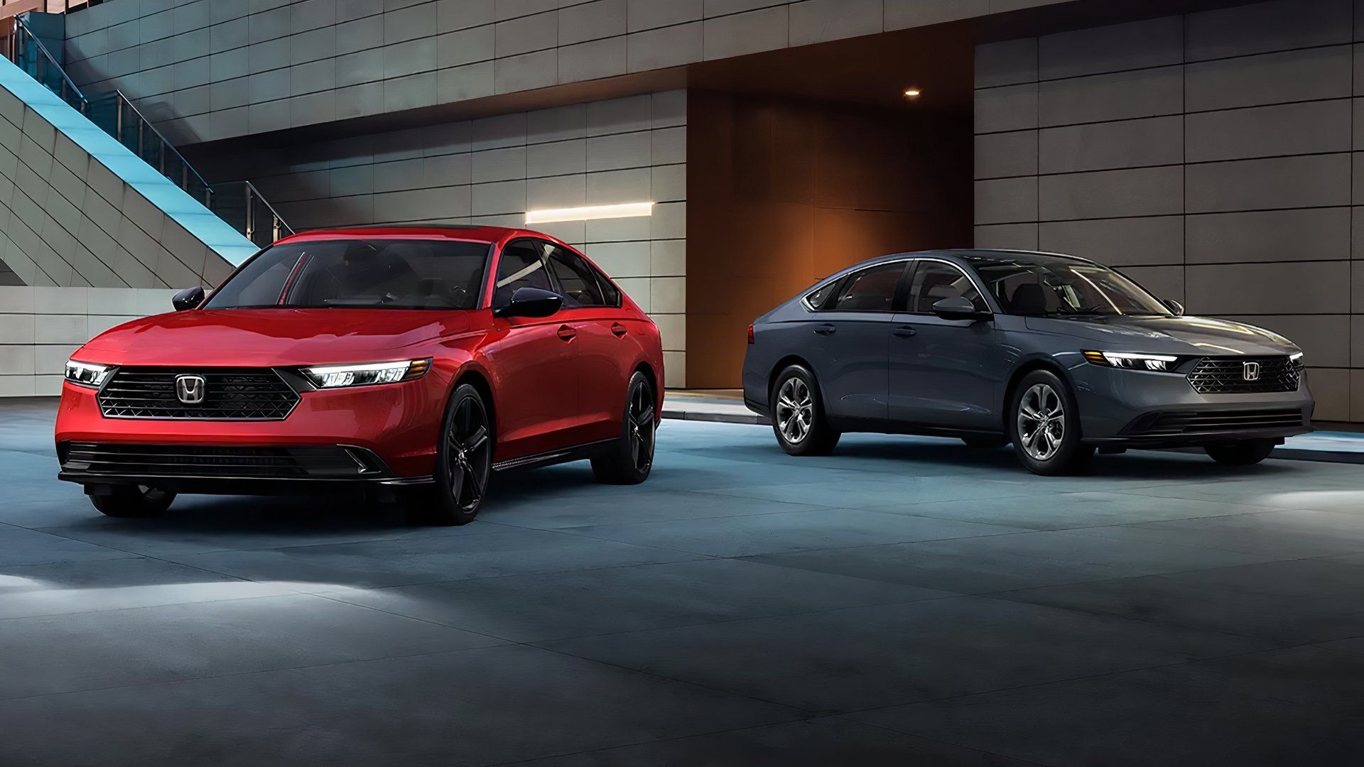 A Gray And Red 2024 Honda Accord Hybrid Side-By-Side