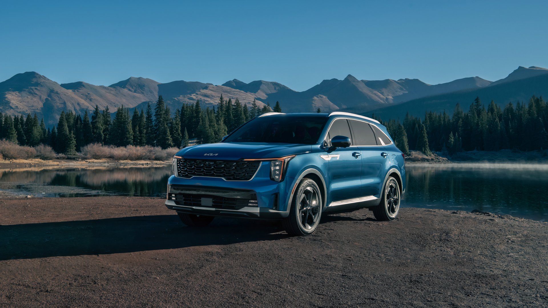 2024 Kia Sorento HEV front 3/4 shot parked in front of a lake