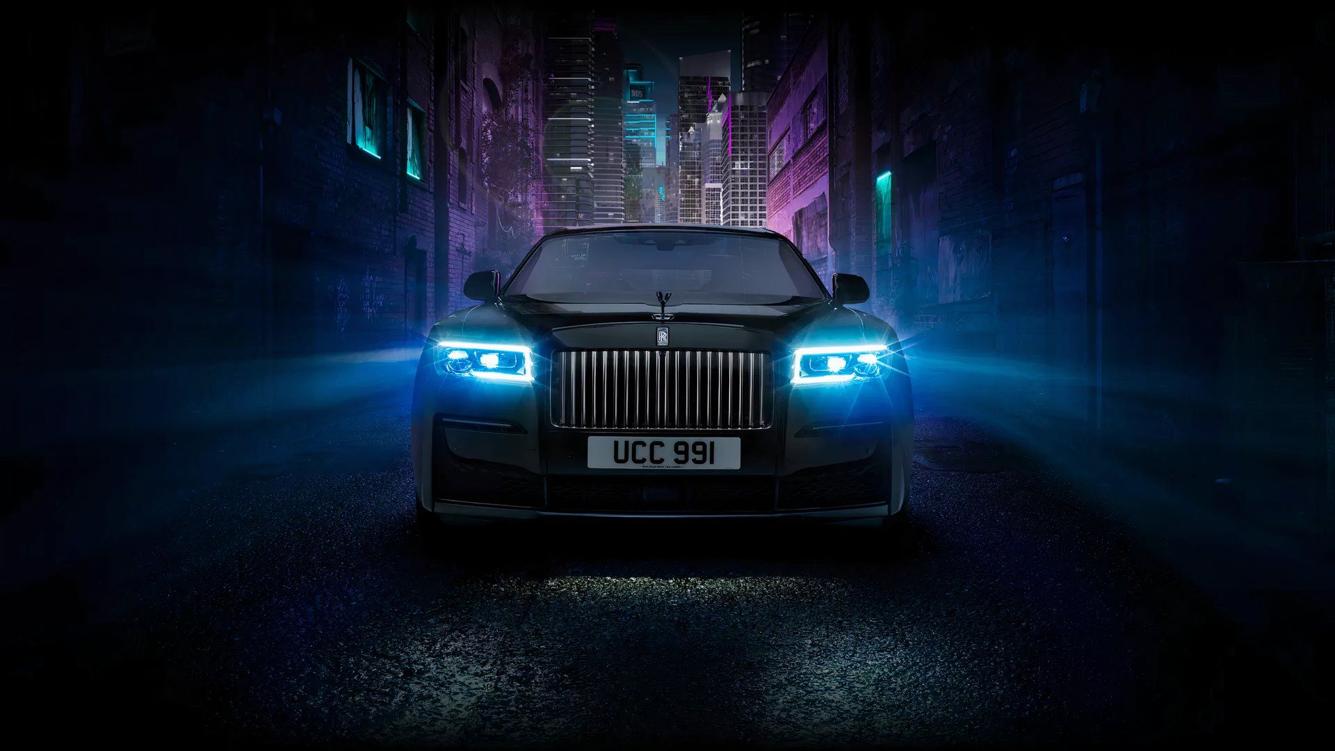 2024 Rolls-Royce Black Badge Ghost in black Posing in city at night