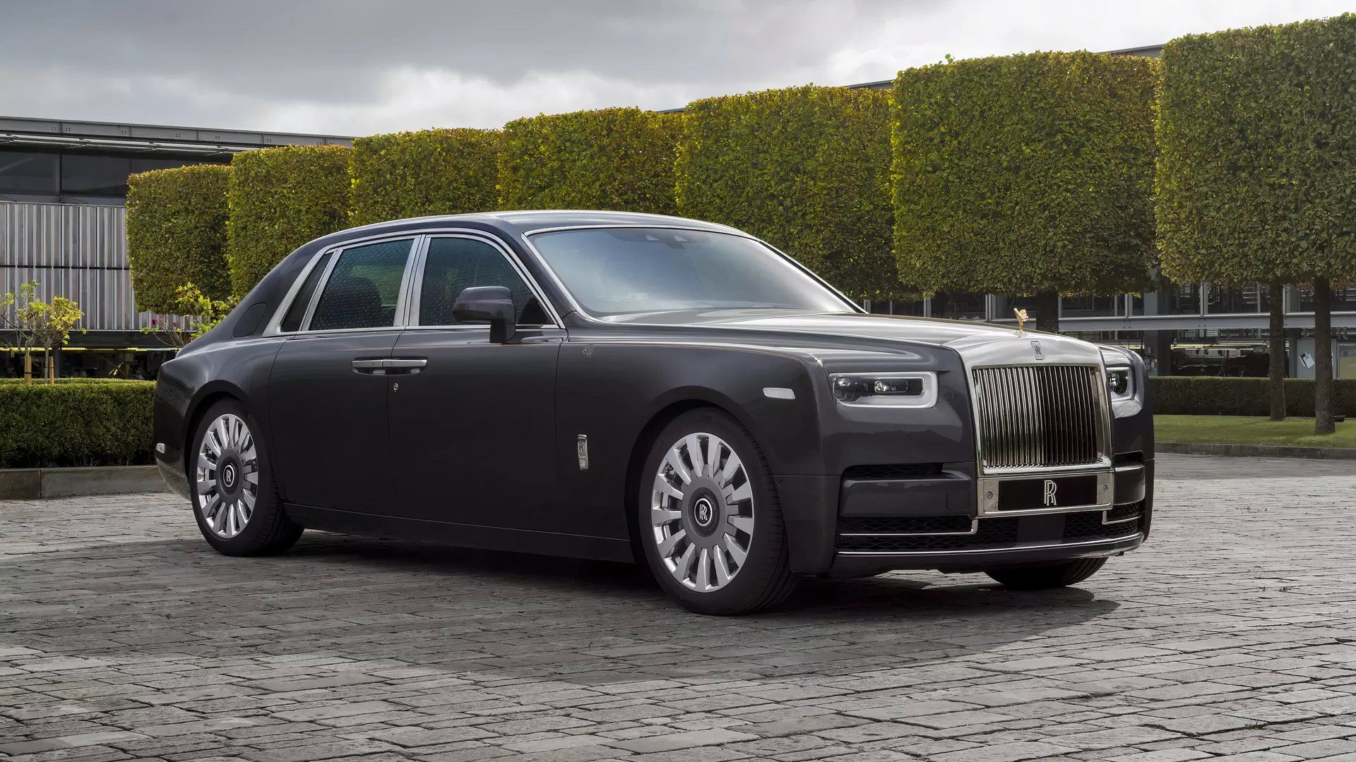 2024 Rolls-Royce Phantom in gray Posing on driveway of modern home