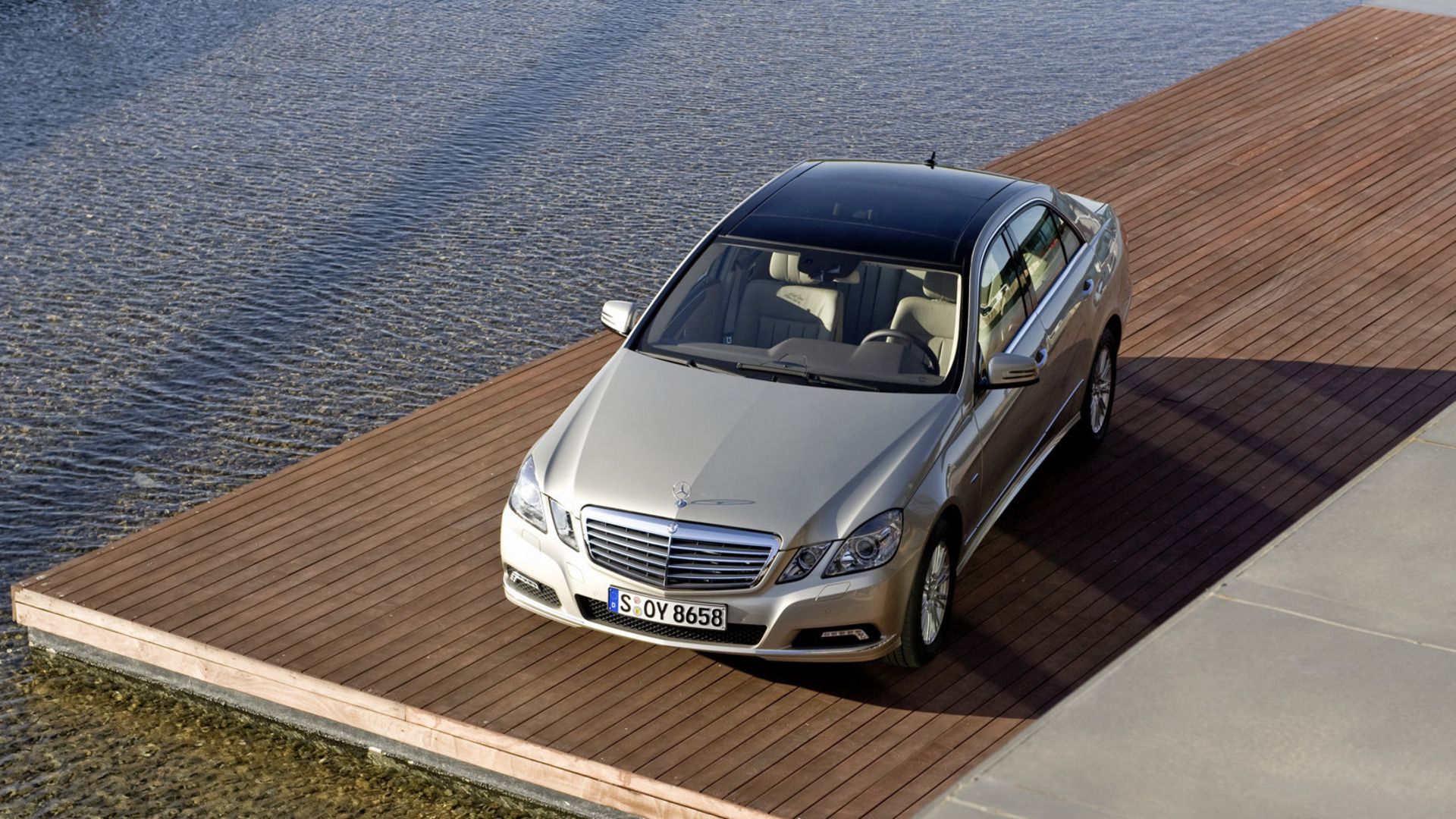 Silver 2010 Mercedes-Benz E 350 Sedan Parked On Deck Top 3/4 View