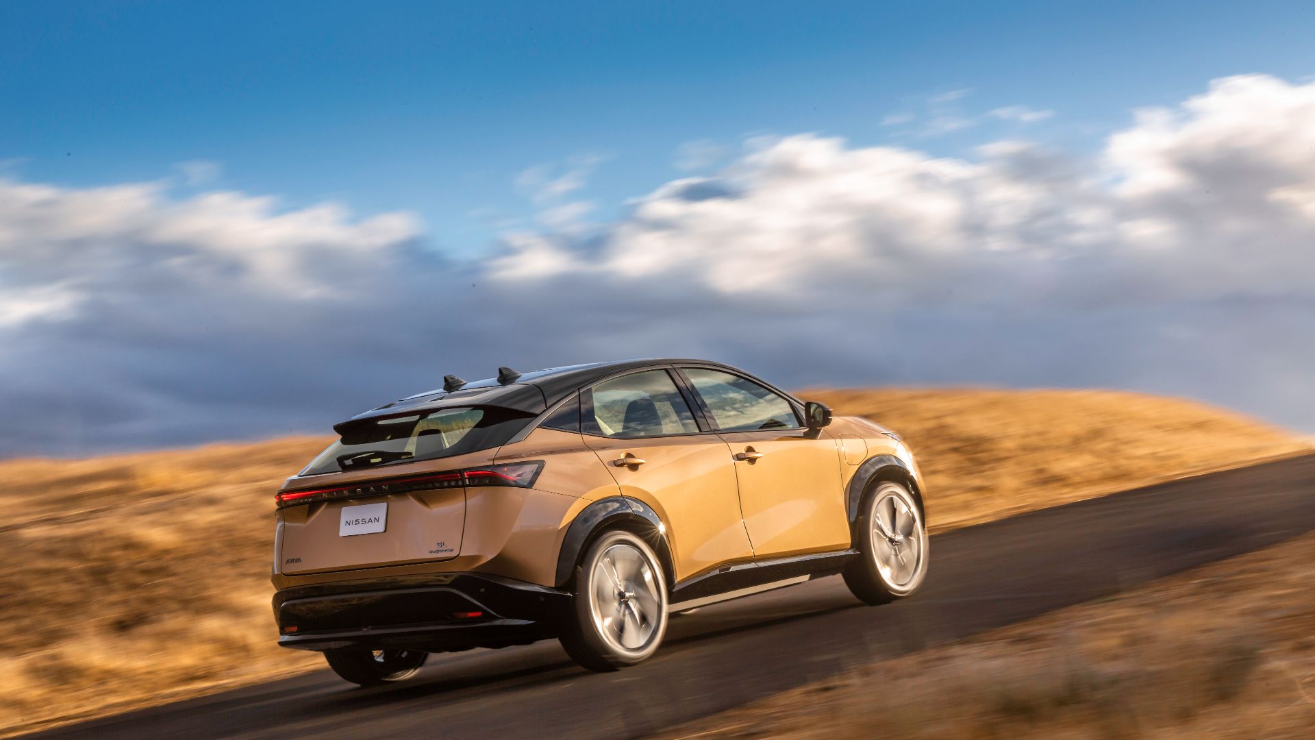 2023 Nissan Ariya who drives over a road.