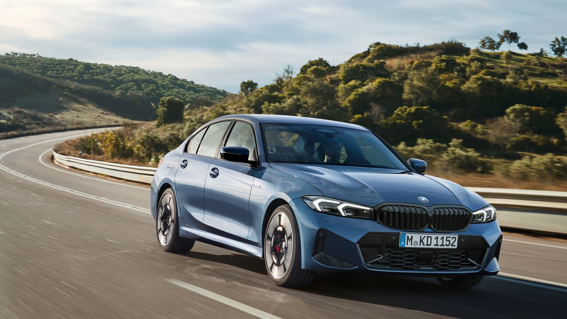 Front three-quarters shot of a blue 2025 BMW 3 Series