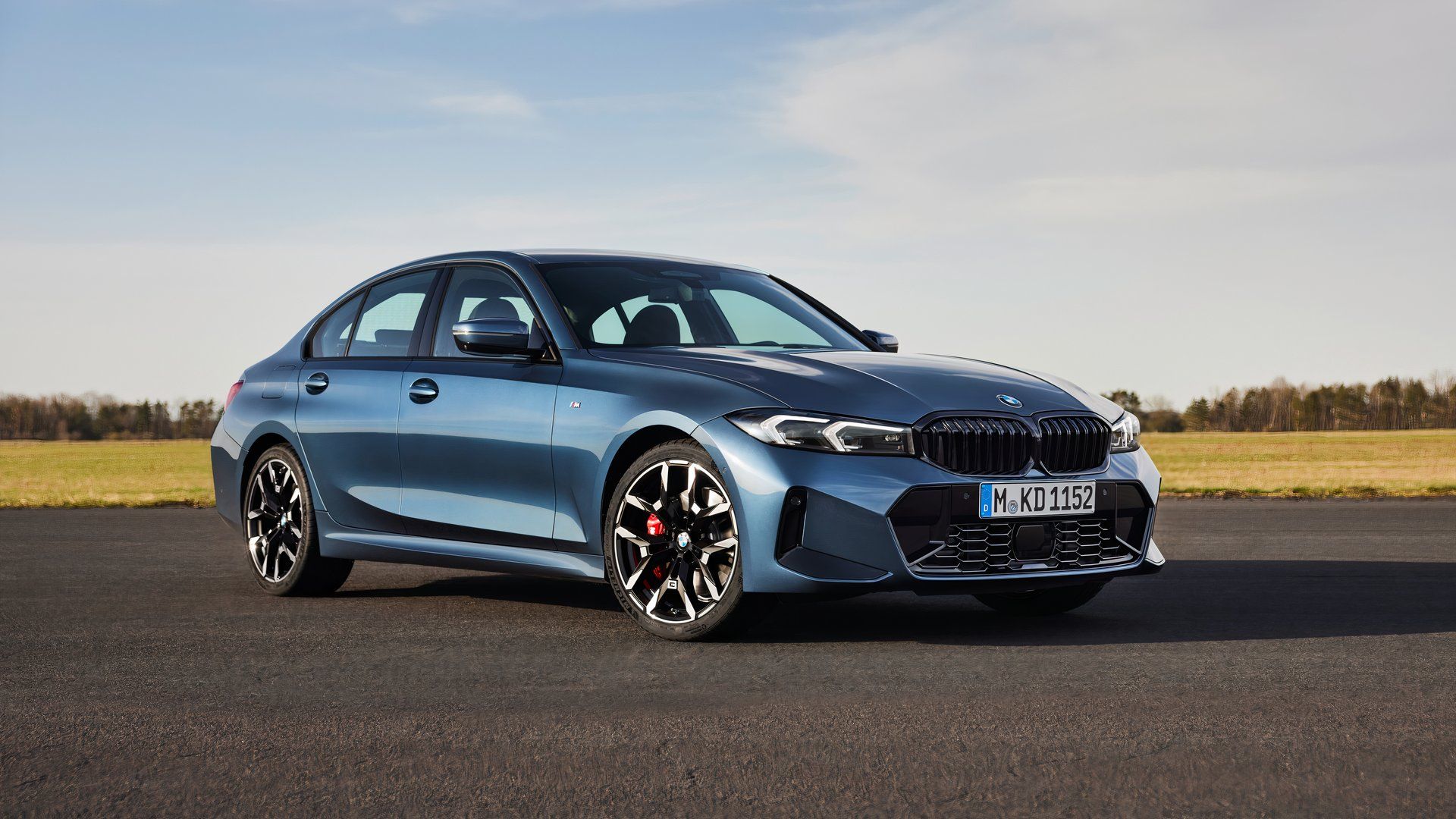 Front three-quarters shot of a blue 2025 BMW 3 Series