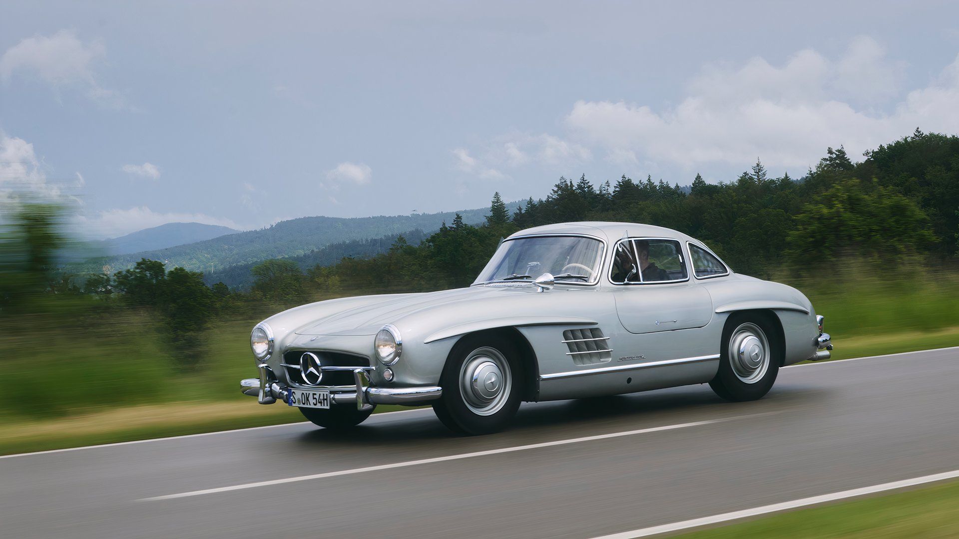 Mercedes-Benz 300SL 1957 dirigindo tiro frontal TopSpeed-1