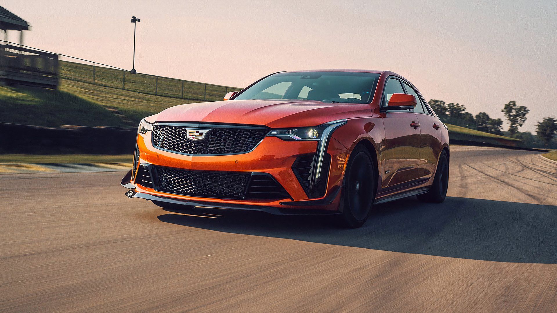 An Orange 2023 Cadillac CT4-V Blackwing Driving