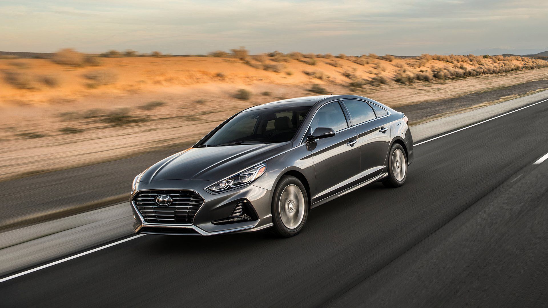 blue-2018-hyundai-sonata-driving-on-road 10 Cheap Cars For Highway Driving