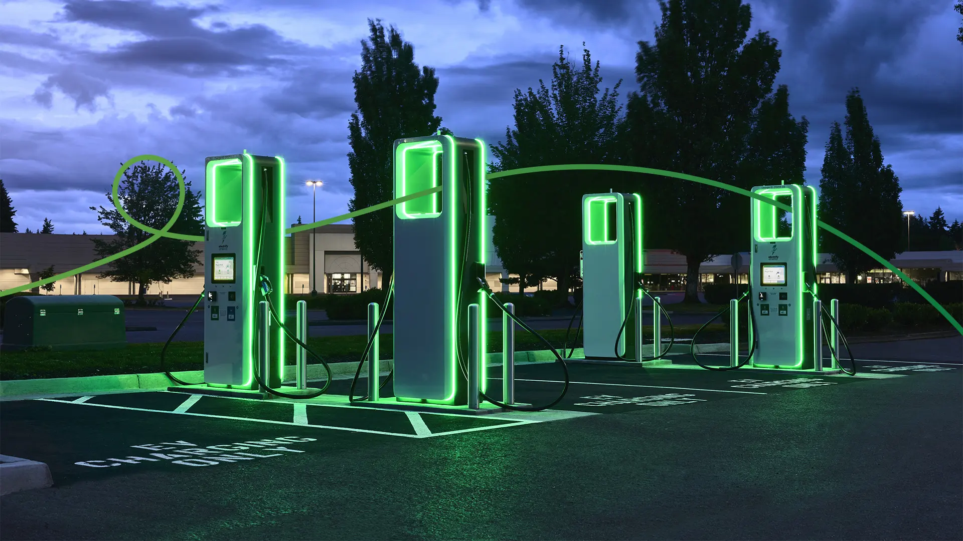 Photo of an Electrify America charging station at night