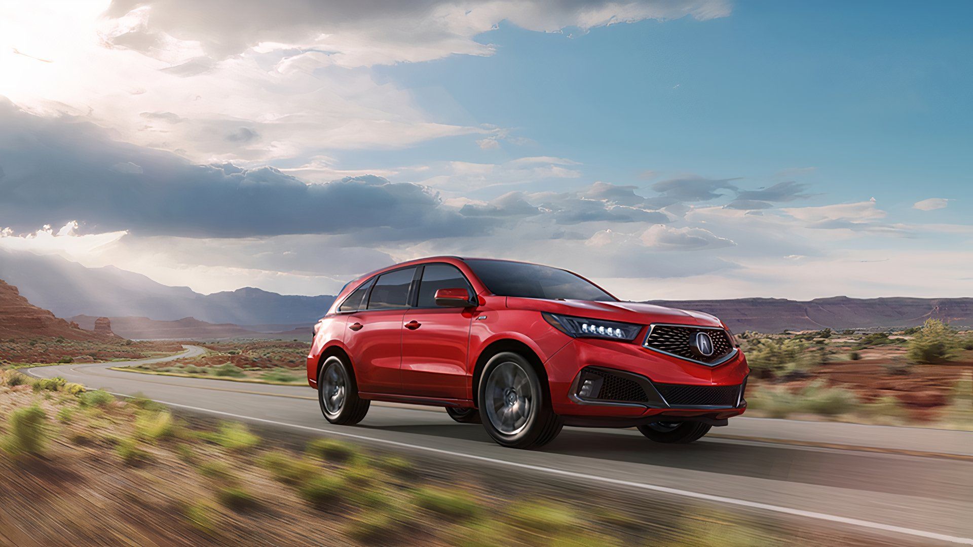 Red 2019 Acura MDX driving 