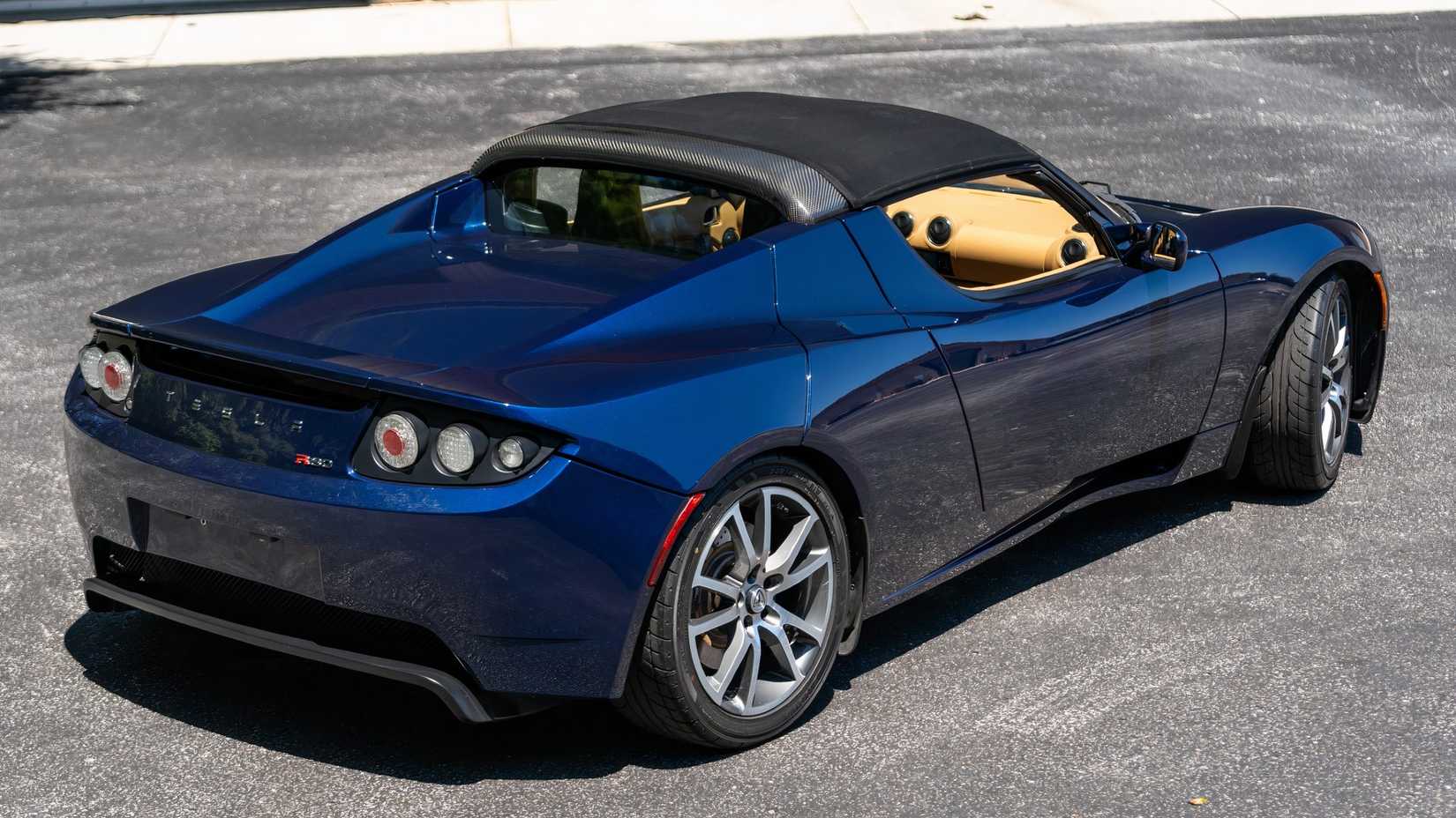 Rear three-quarters shot of a blue 2010 Tesla Roadster 
