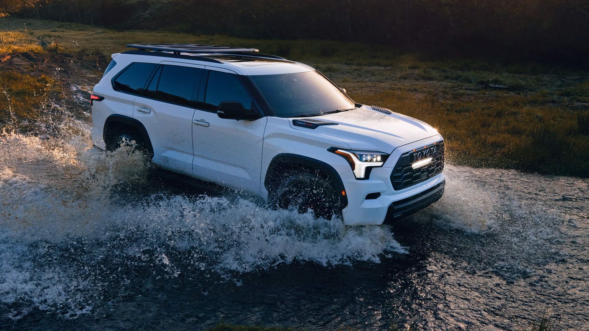 A white Toyota Sequoia TRD Pro 2024 drives through water