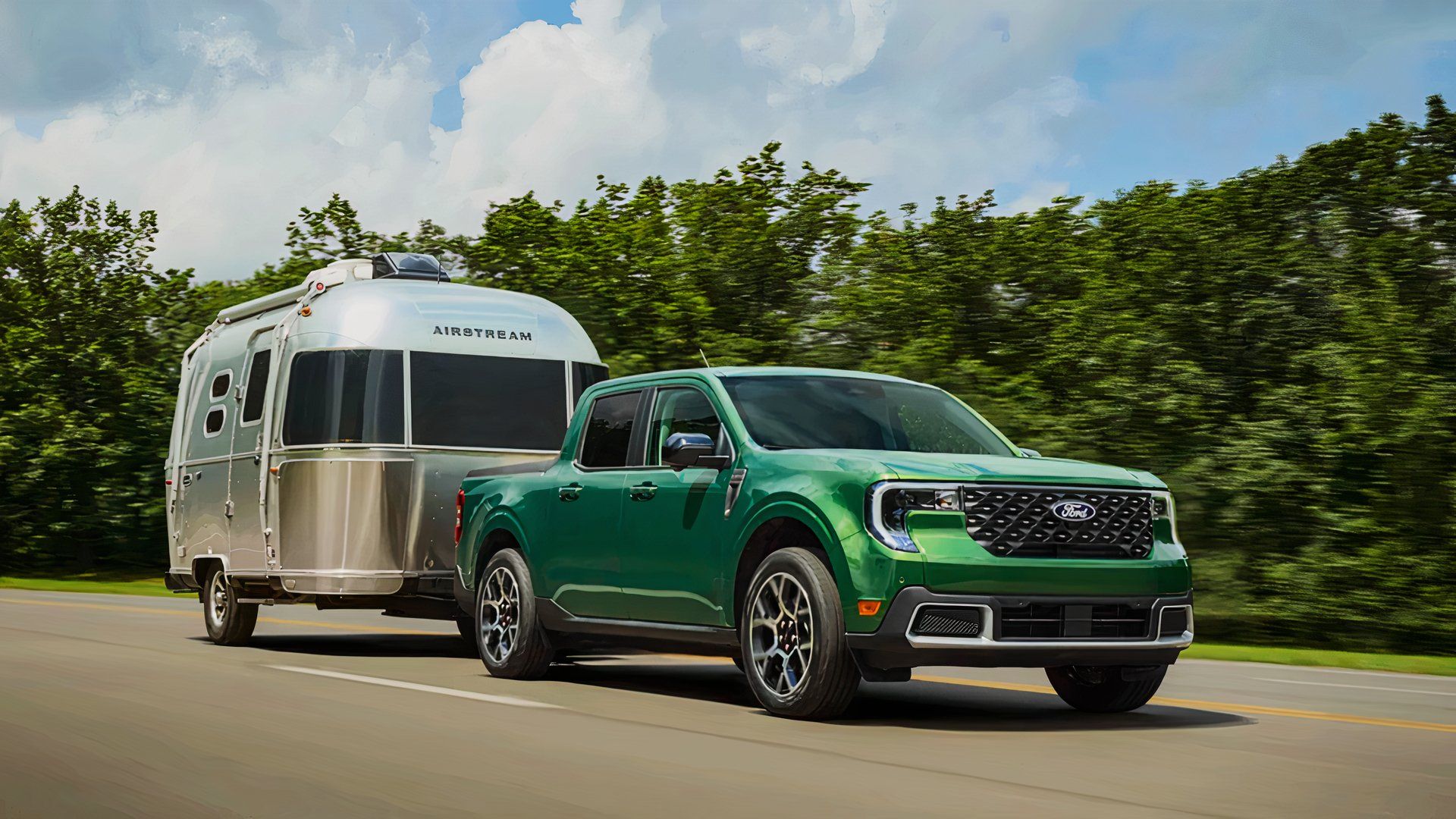 A green 2025 Ford Maverick pulls an Airstream trailer. 