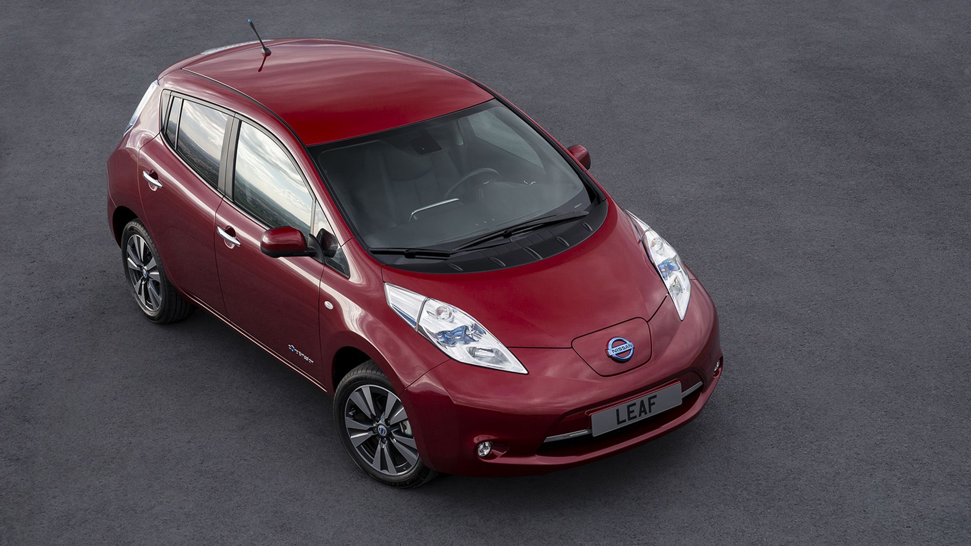A Red 2010 Nissan Leaf Parked
