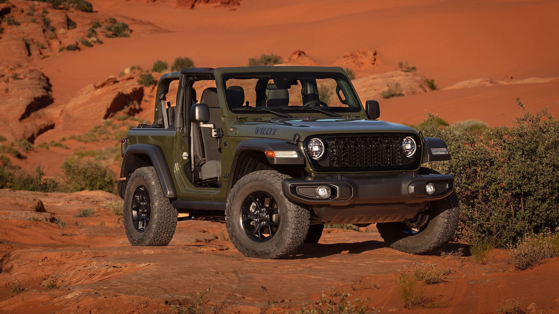 2023 Jeep Wrangler Willys in green parked off road